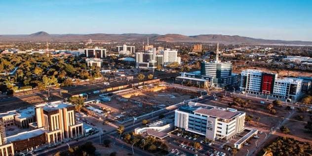 An aerial view of the Gaborone city skyline at sunset
