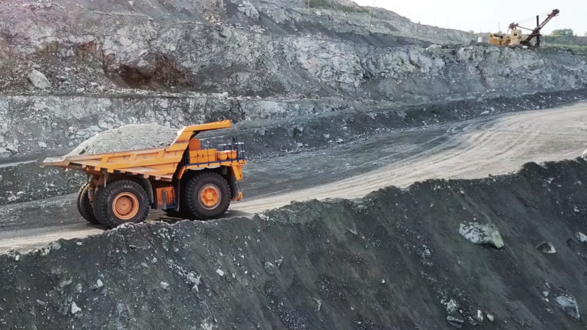 A haul truck on a mining site access road