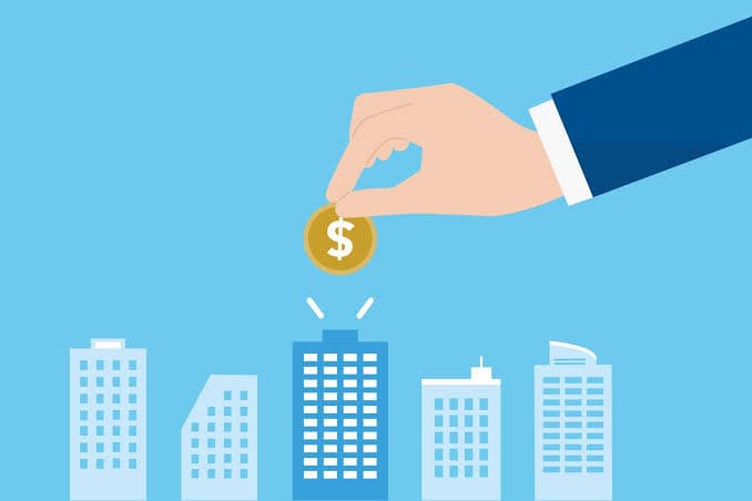 Illustration of capital being invested into a skyline of buildings